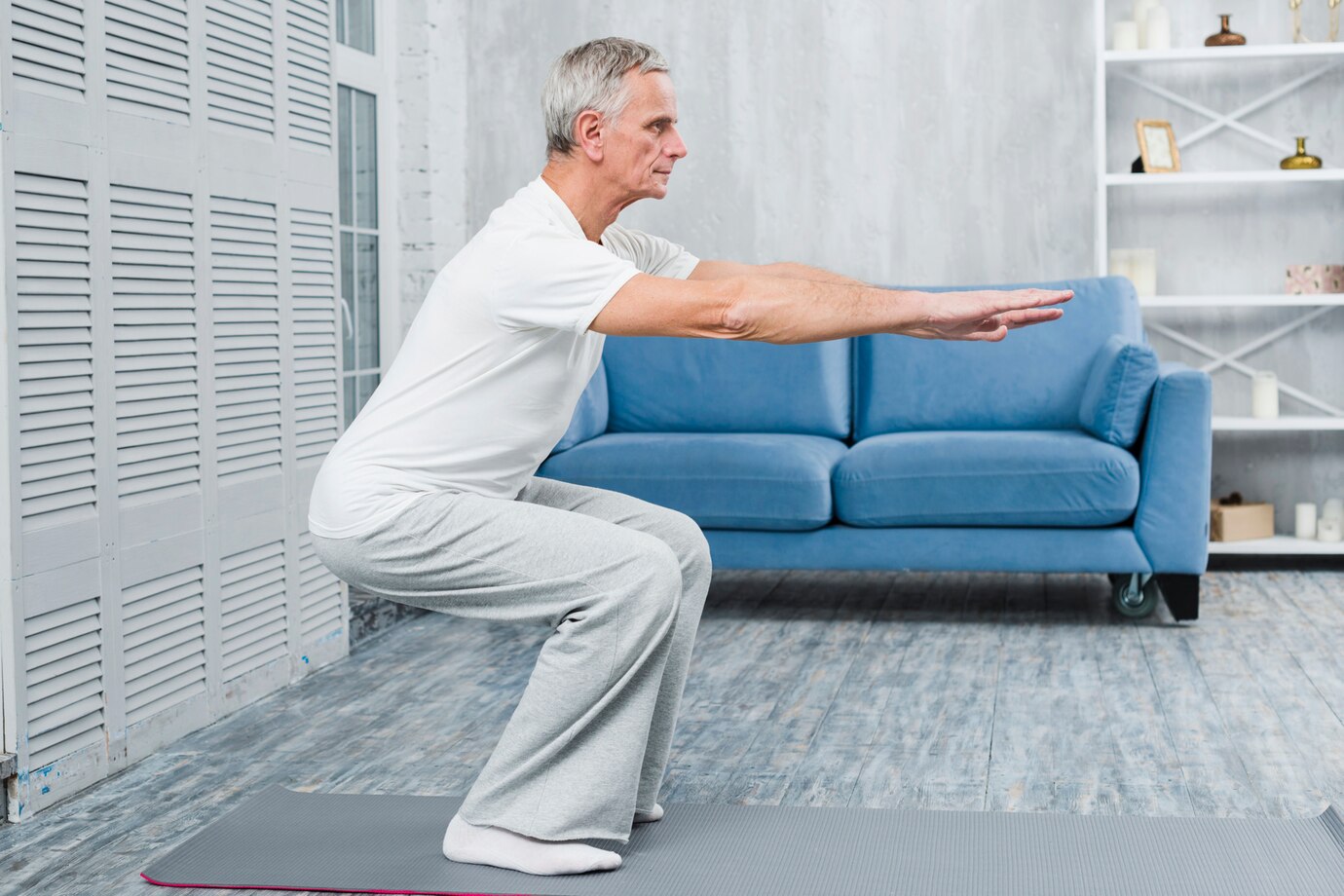 senior-man-exercising-home_23-2148097397